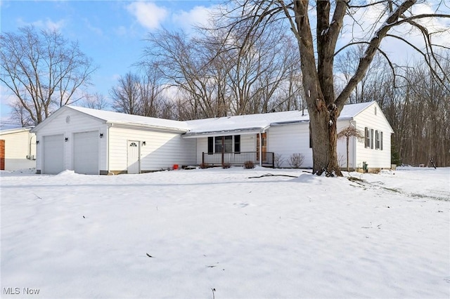 single story home with a porch and a garage