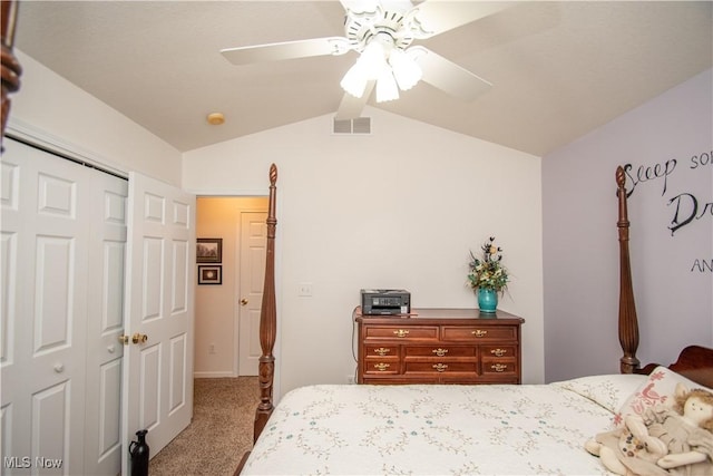 bedroom featuring lofted ceiling, carpet flooring, ceiling fan, and a closet