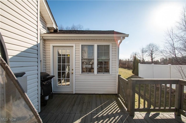 wooden terrace featuring a grill