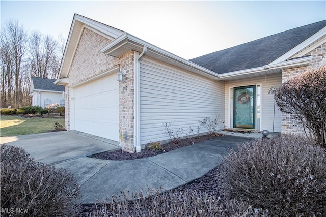 view of exterior entry with a garage