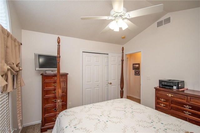 bedroom with lofted ceiling, carpet floors, a closet, and ceiling fan