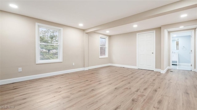 spare room featuring light hardwood / wood-style flooring