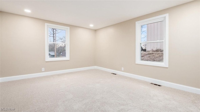 unfurnished room featuring carpet flooring