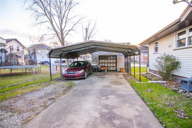 view of parking featuring a trampoline and a carport