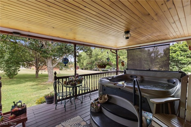 wooden deck featuring grilling area and a lawn