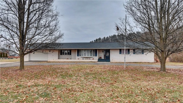 ranch-style home with a garage