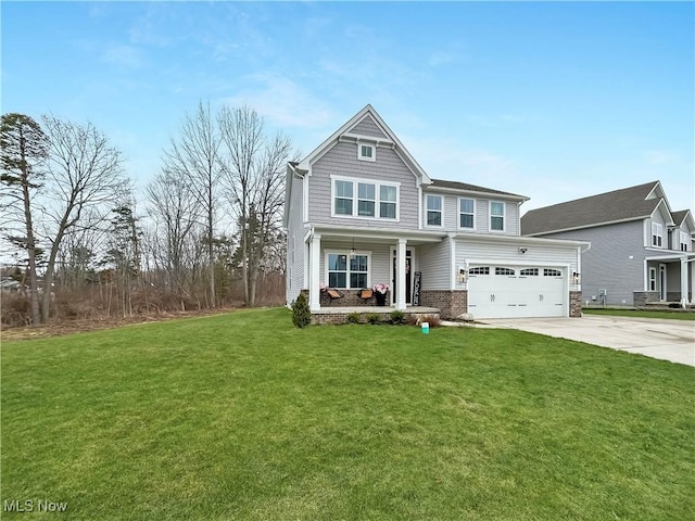 craftsman house with covered porch, concrete driveway, and a front lawn