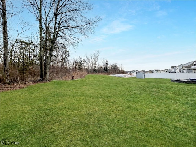 view of yard with fence