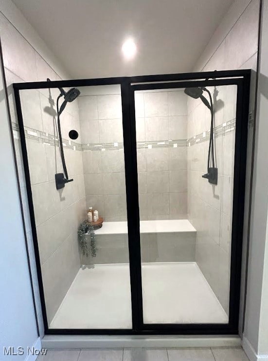 full bathroom featuring a shower stall