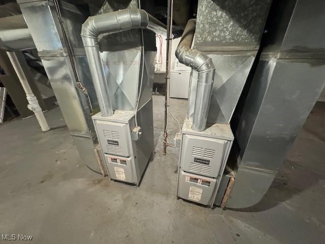 utility room featuring heating unit