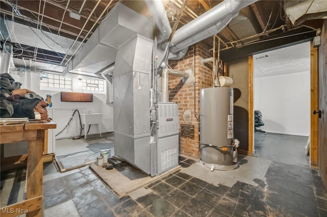 basement featuring heating unit and water heater