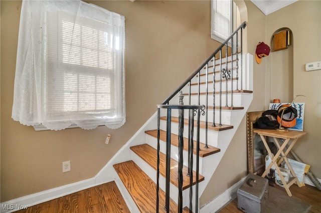 stairway featuring hardwood / wood-style flooring