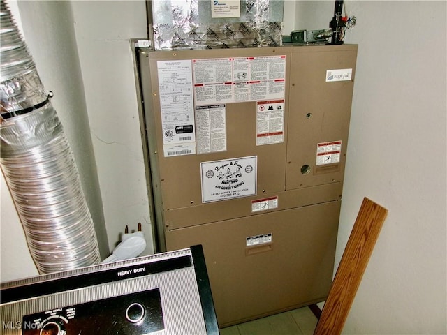 utility room with heating unit