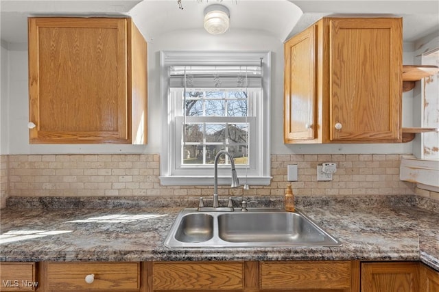 kitchen featuring sink and decorative backsplash