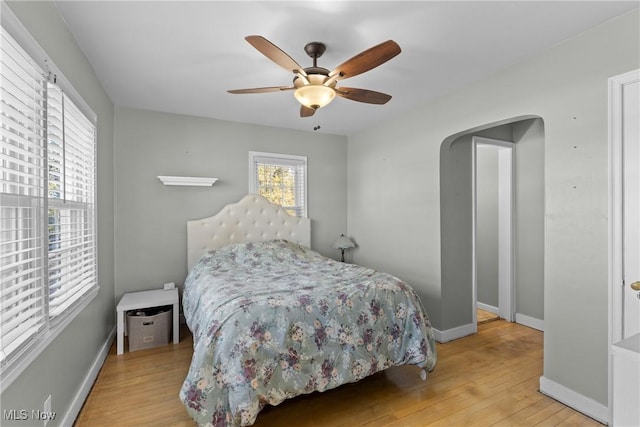 bedroom featuring ceiling fan and light hardwood / wood-style floors