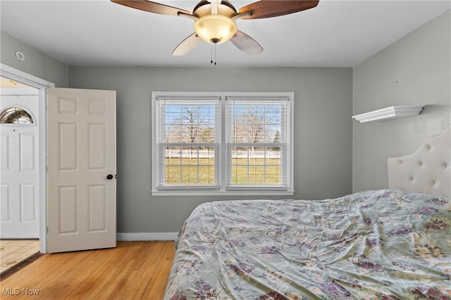 bedroom with ceiling fan and light wood-type flooring