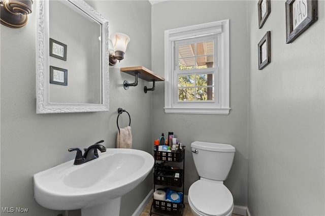 bathroom with sink and toilet