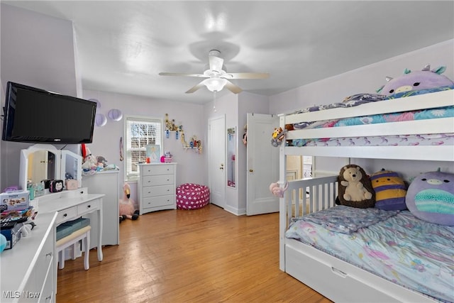 bedroom with ceiling fan and light hardwood / wood-style flooring