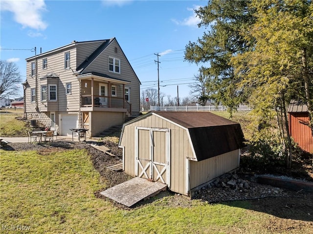 view of outbuilding featuring a lawn