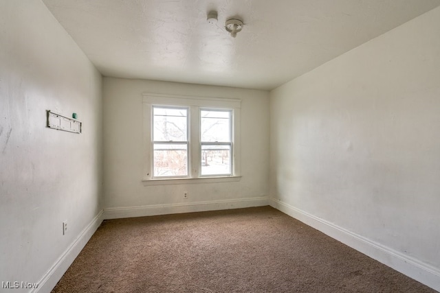 unfurnished room with carpet floors