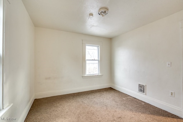 view of carpeted spare room