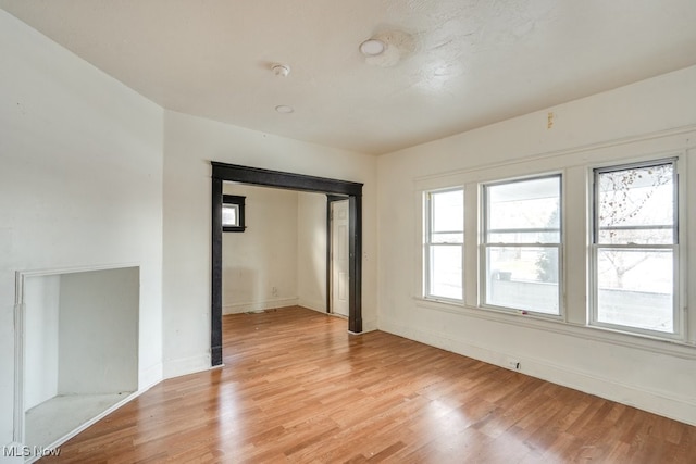 spare room featuring light wood-type flooring