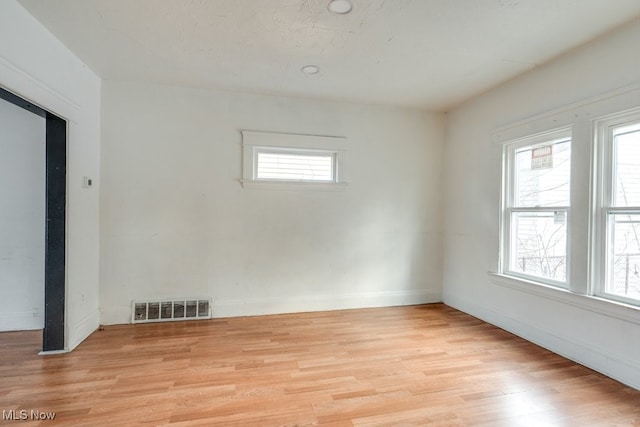 unfurnished room featuring light wood-type flooring