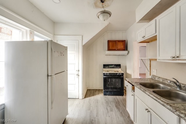 kitchen with white appliances, light hardwood / wood-style floors, sink, and white cabinets