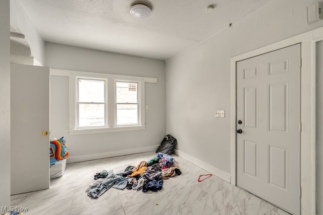 interior space featuring a textured ceiling