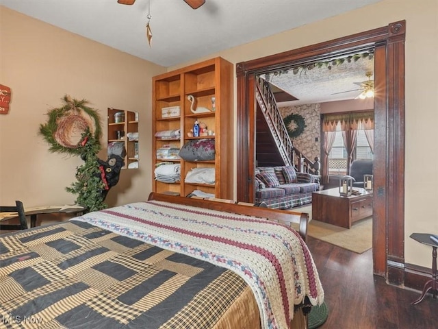 bedroom featuring ceiling fan and dark hardwood / wood-style floors