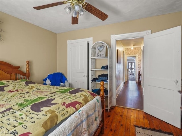 bedroom featuring dark wood-type flooring and ceiling fan