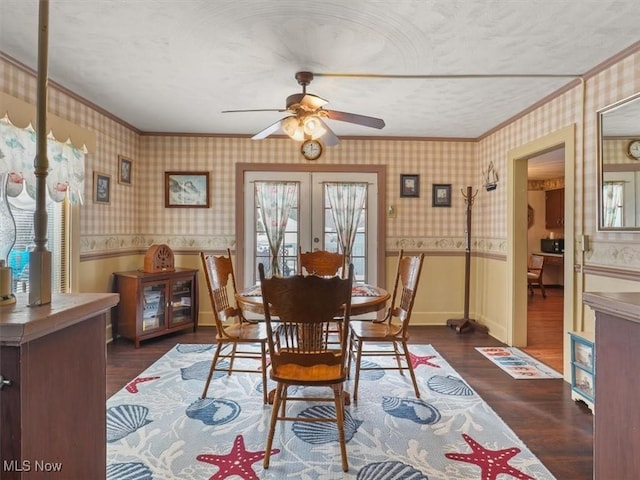 dining space featuring french doors, a textured ceiling, ornamental molding, dark hardwood / wood-style flooring, and ceiling fan