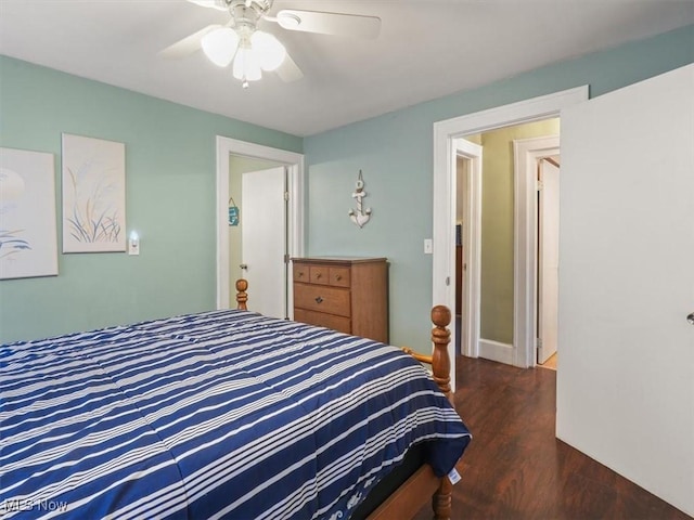 bedroom with ceiling fan and dark hardwood / wood-style flooring