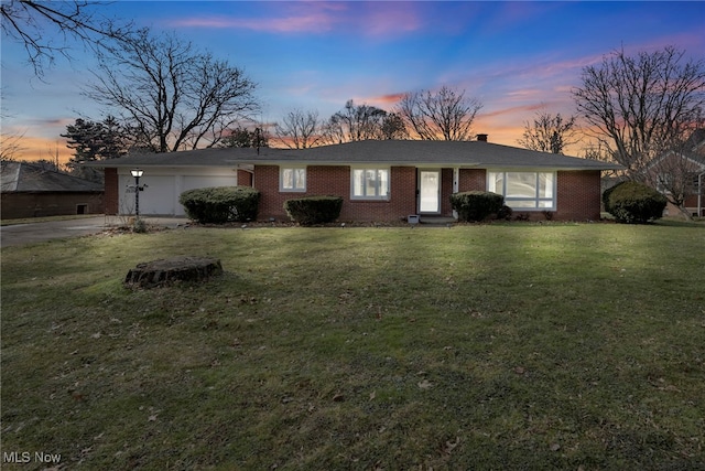 single story home featuring a yard