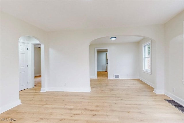 unfurnished room with light hardwood / wood-style floors