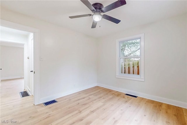 spare room with ceiling fan and light hardwood / wood-style flooring