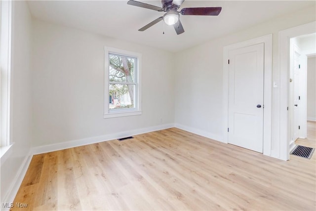 spare room with ceiling fan and light hardwood / wood-style floors