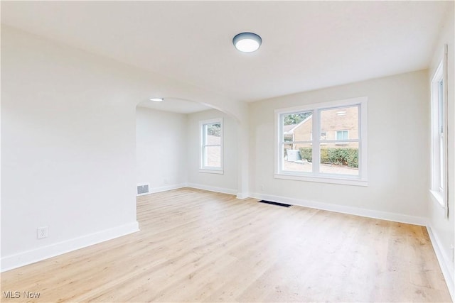 spare room featuring light wood-type flooring