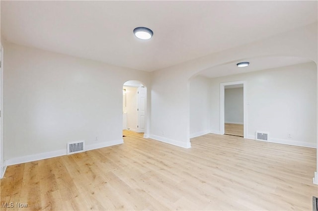 unfurnished room with light hardwood / wood-style flooring