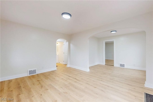 unfurnished room featuring light wood-type flooring