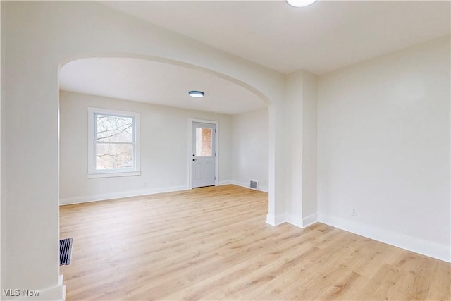 unfurnished room featuring light hardwood / wood-style floors