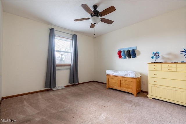 unfurnished bedroom featuring light colored carpet and ceiling fan