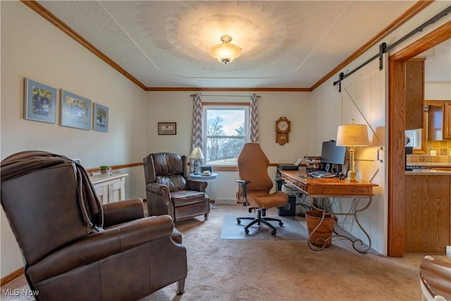 carpeted office with crown molding and a barn door