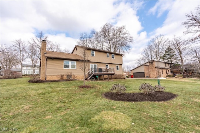 rear view of property featuring a wooden deck, a garage, and a lawn