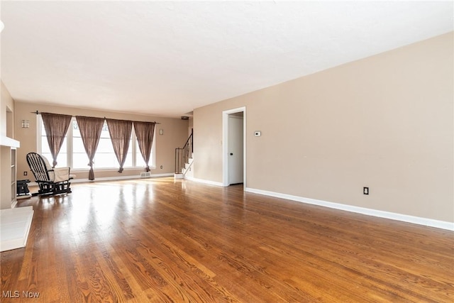 unfurnished room featuring hardwood / wood-style floors