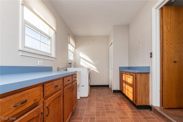 laundry area with cabinets