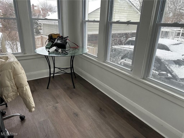 sunroom / solarium featuring a healthy amount of sunlight