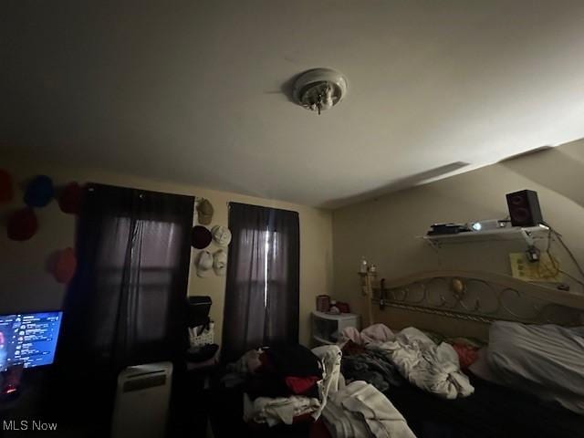 bedroom with lofted ceiling