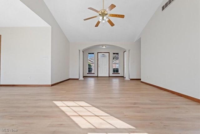 unfurnished living room with light hardwood / wood-style flooring, high vaulted ceiling, and ceiling fan