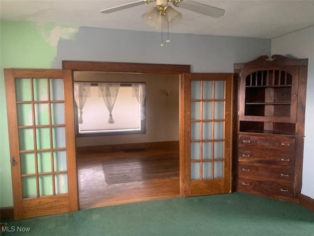 empty room with wood-type flooring and ceiling fan